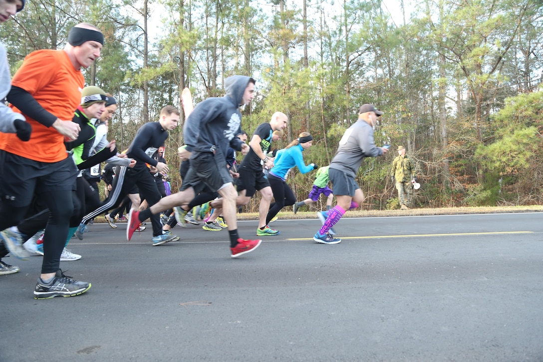 Participants take off from the starting line during the Xtreme Endurance Challenge 12k+ held on Marine Corps Air Station New River on Feb. 6. The X-treme Endurance Challenge 12k+ is part of Marine Corps Community Services Semper Fit Grand Prix races.  (U.S. Marine Corps photo by Cpl. Mark Watola /released)