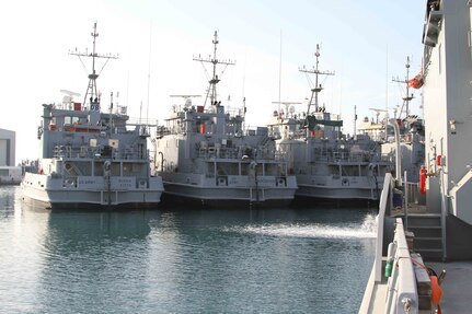 Landing Craft Utility boats sit in dock at the Kuwait Naval Base as part of APS-5 Kuwait, an army prepositioned wartime stocks program. APS-5 maintains over 30 Army watercraft in ready-for-issue condition as part of Army Central’s contingency operations strategy. (U.S. Army photo by Master Sgt. Dave Thompson, released)
