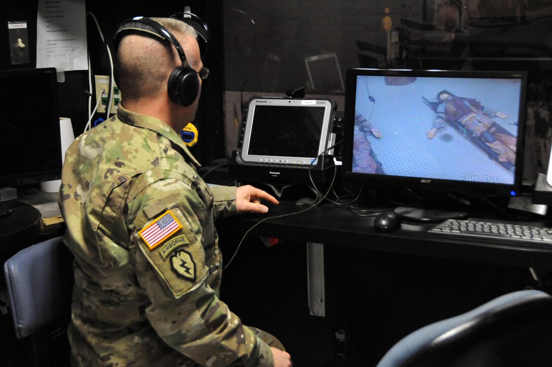 Sgt. 1st Class David Lovett, course coordinator at the Army Reserve's
Medical Skills Training Center on Joint Base McGuire-Dix-Lakehurst, New
Jersey, manages the realistic lifesaving training needed for combat medics'
EMT certification.