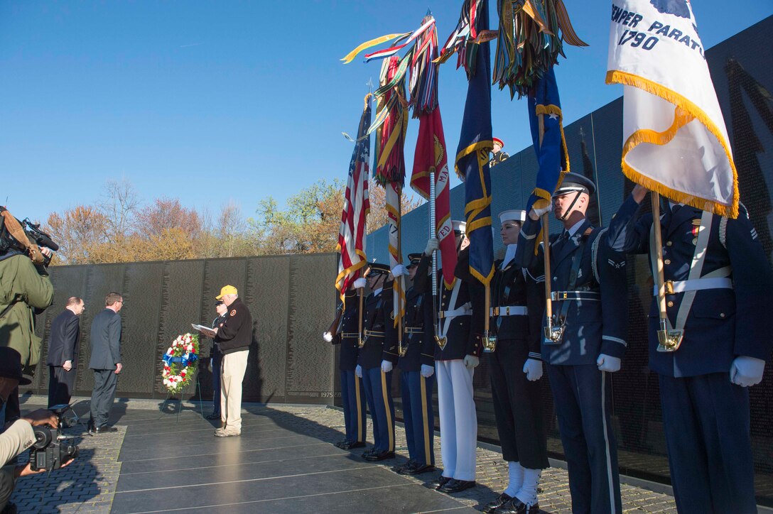 Defense Secretary Ash Carter, back right, and Veterans Affairs Secretary Bob McDonald prepare to lay a wreath at the Vietnam Veterans Memorial in Washington, D.C., March 29, 2016. DoD photo by Navy Petty Officer 1st Class Tim D. Godbee