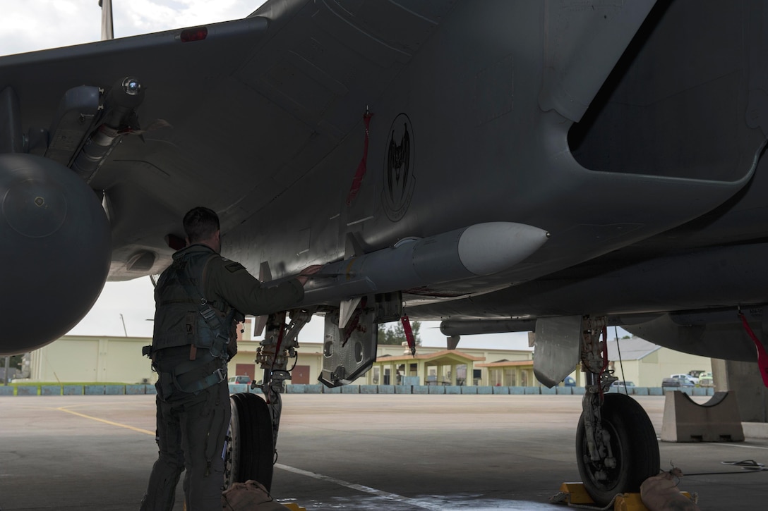 Navy Lt. Dustin Henze conducts preflight checks on an F-16 Eagle aircraft during a no-notice exercise at Kadena Air Base, Japan, March 18, 2016. Henze is a Navy exchange pilot assigned to the 44th Fighter Squadron. Air Force photo by Airman 1st Class Lynette M. Rolen