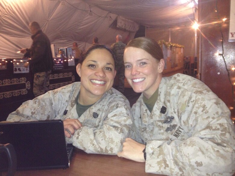 Chief Petty Officer Jaclyn Place poses for a picture with her friend Chief Petty Officer 2 Breighanna Cather. Place is a lead chief petty officer with the Headquarters Regimental Aid Station, 1st Marine Logistics Group, and was awarded an impact Navy and Marine Corps Commendation Medal for her selfless and decisive actions that saved the lives of her neighbors. (U.S. Marine Corps photo by Sgt. Laura Gauna/released)