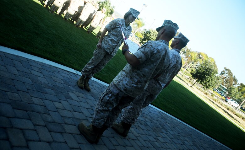 Chief Petty Officer Jaclyn Place is awarded an impact Navy and Marine Corps Commendation Medal aboard Camp Pendleton, Calif., March 11, 2016. Place is a lead chief petty officer with the Headquarters Regimental Aid Station, 1st Marine Logistics Group, was awarded this for her selfless and decisive actions that saved the lives of her neighbors. (U.S. Marine Corps photo by Sgt. Laura Gauna/released)