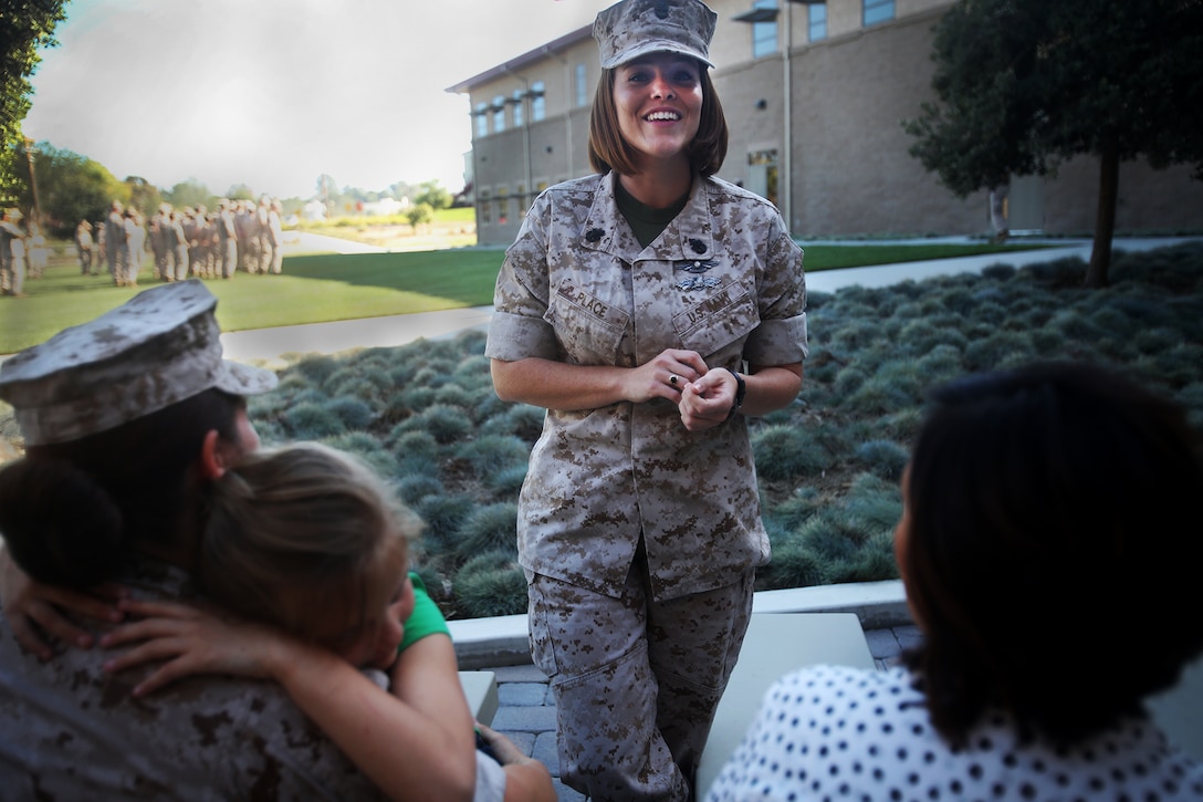 Chief Petty Officer Jaclyn Place laughs at a joke while she waits for her award ceremony to begin aboard Camp Pendleton, Calif., March 11, 2016. Place is a lead chief petty officer with the Headquarters Regimental Aid Station, 1st Marine Logistics Group, and was awarded an Impact Navy and Marine Corps Commendation Medal for her selfless and decisive actions that saved the lives of her neighbors. (U.S. Marine Corps photo by Sgt. Laura Gauna/released)