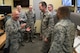 Chief Master Sgt. Jose Barraza (left), 12th Air Force (Air Forces Southern) command chief, laughs with the 366th Operations Support Squadron weather flight at Mountain Home Air Force Base, Idaho, March 23, 2016. Barraza visited the base with Lt. Gen. Chris Nowland, 12th AF (Air Forces Southern) commander, prior to the 366th Fighter Wing change of command ceremony. (U.S. Air Force photo by Tech. Sgt. Samuel Morse/RELEASED)