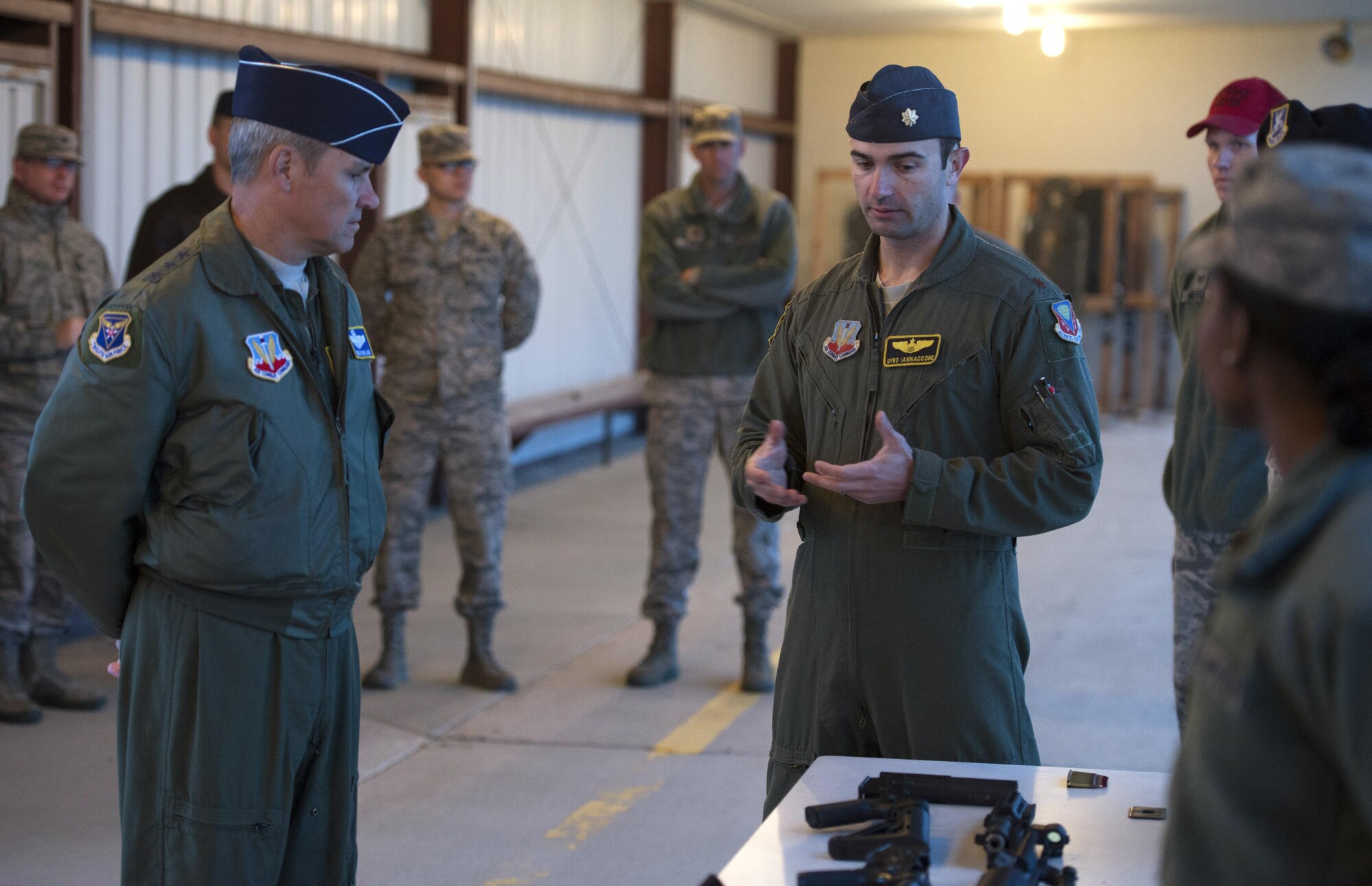 Maj. Jeffrey Iannaccone, 391st Fighter Squadron director of staff, instructed Lt. Gen. Chris Nowland, 12th Air Force (Air Forces Southern) commander, before Nowland trained with a GAU-5 at the off base shooting range outside of Mountain Home Air Force Base, Idaho, March 24, 2016. (U.S. Air Force photo by Airman 1st Class Chester Mientkiewicz/Released)