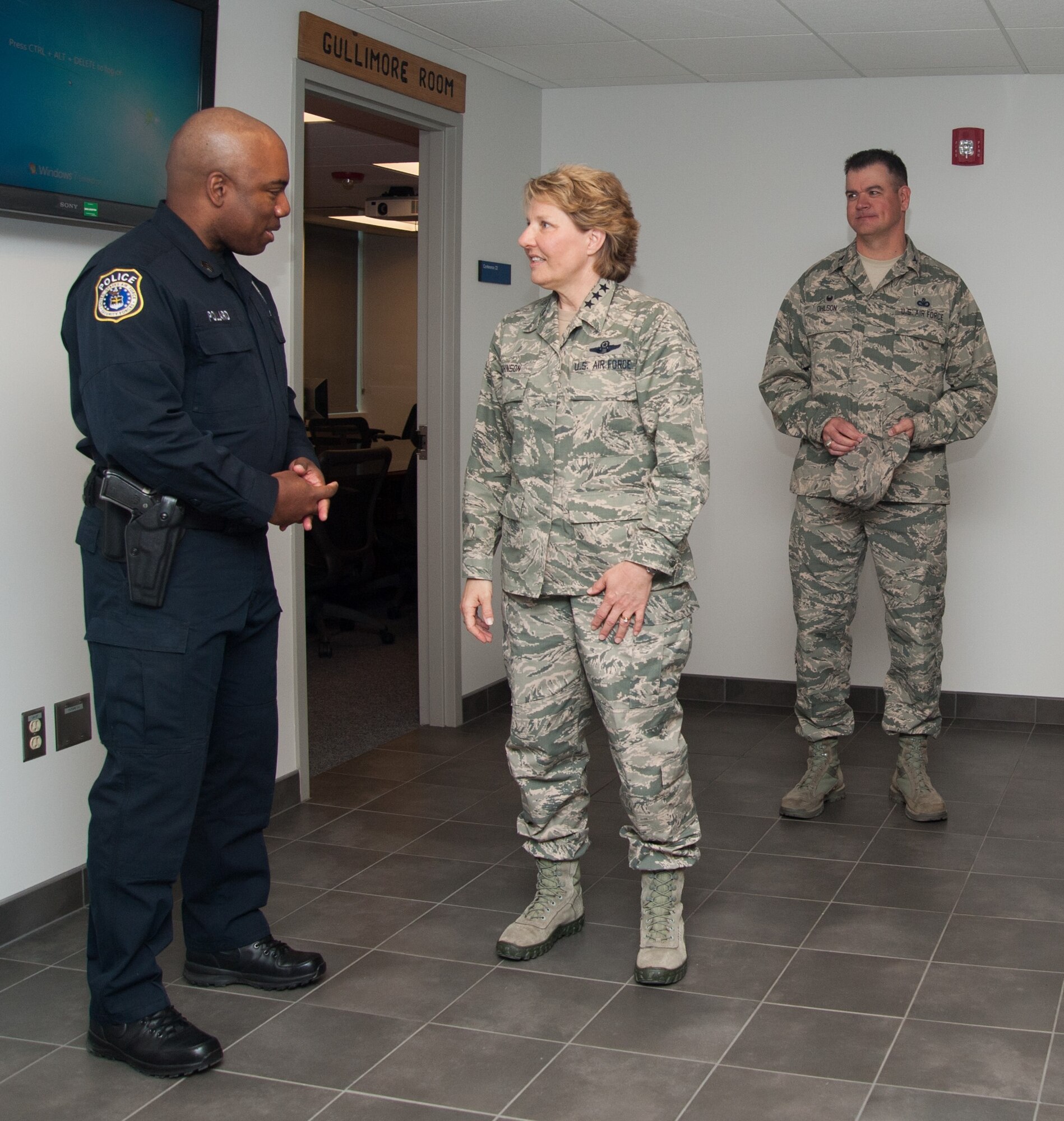 Department of the Air Force Police Officer Fabian Pollard (left) chats with Lt. Gen. Michelle Johnson, the superintendent of the U.S. Air Force Academy, in the newly renovated 10th Security Forces Squadron March 28, 2016. The main 10th SFS facility was renovated with new equipment and received technology upgrades to better its law enforcement and security services to the Academy community, (U.S. Air Force photo/Liz Copan) 