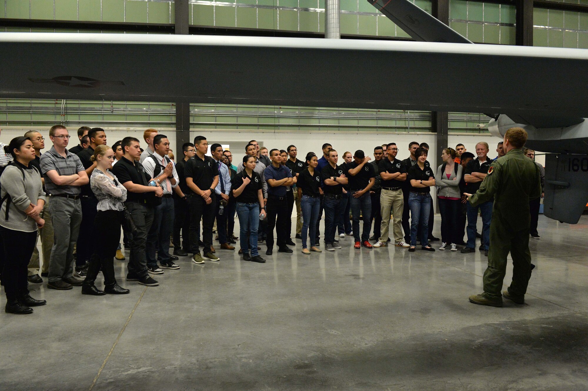 Capt. William, 11th Reconnaissance Squadron MQ-1 Predator pilot, provides valuable feedback to questions regarding MQ-1 and MQ-9 remotely piloted aircraft during a base tour March 11, 2016, at Creech Air Force Base, Nevada. Base tours such as this one help raise awareness of the RPA mission here and abroad. (U.S. Air Force photo by Airman 1st Class Kristan Campbell/Released)