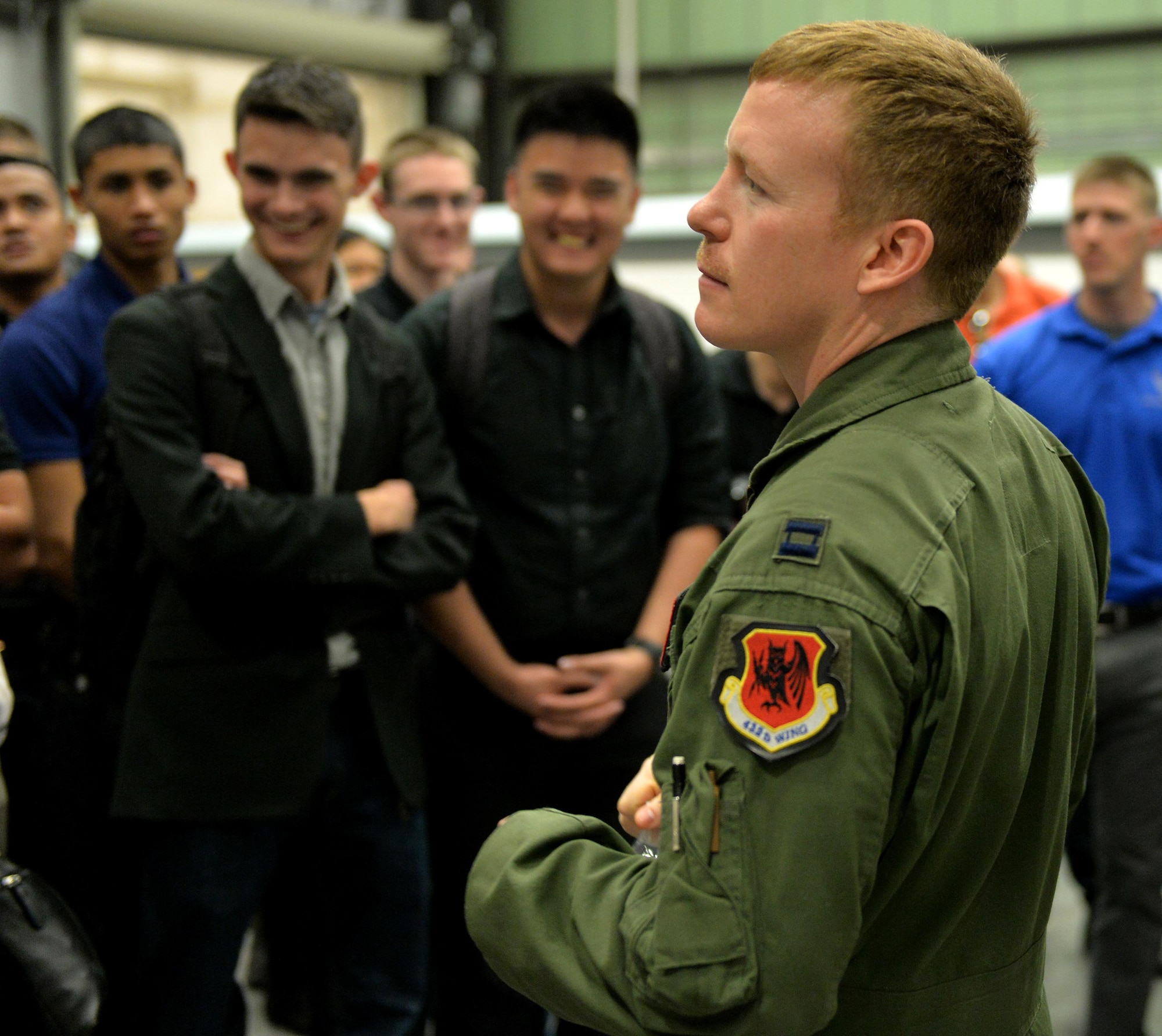 Capt. William, 11th Reconnaissance Squadron MQ-1 Predator pilot, answers questions about MQ-1 and MQ-9 remotely piloted aircraft during a base tour March 11, 2016, at Creech Air Force Base, Nevada. Along with a tour of the 11th RS hangar, cadets from the Reserve Officer Training Corps Detachment 004, Las Vegas were provided a briefing including video feed taken from the MQ-1 Predator and MQ-9 Reaper in action. Information about RPAs provide the cadets with valuable information to consider when choosing which career field they would like to train into. (U.S. Air Force photo by Airman 1st Class Kristan Campbell/Released)