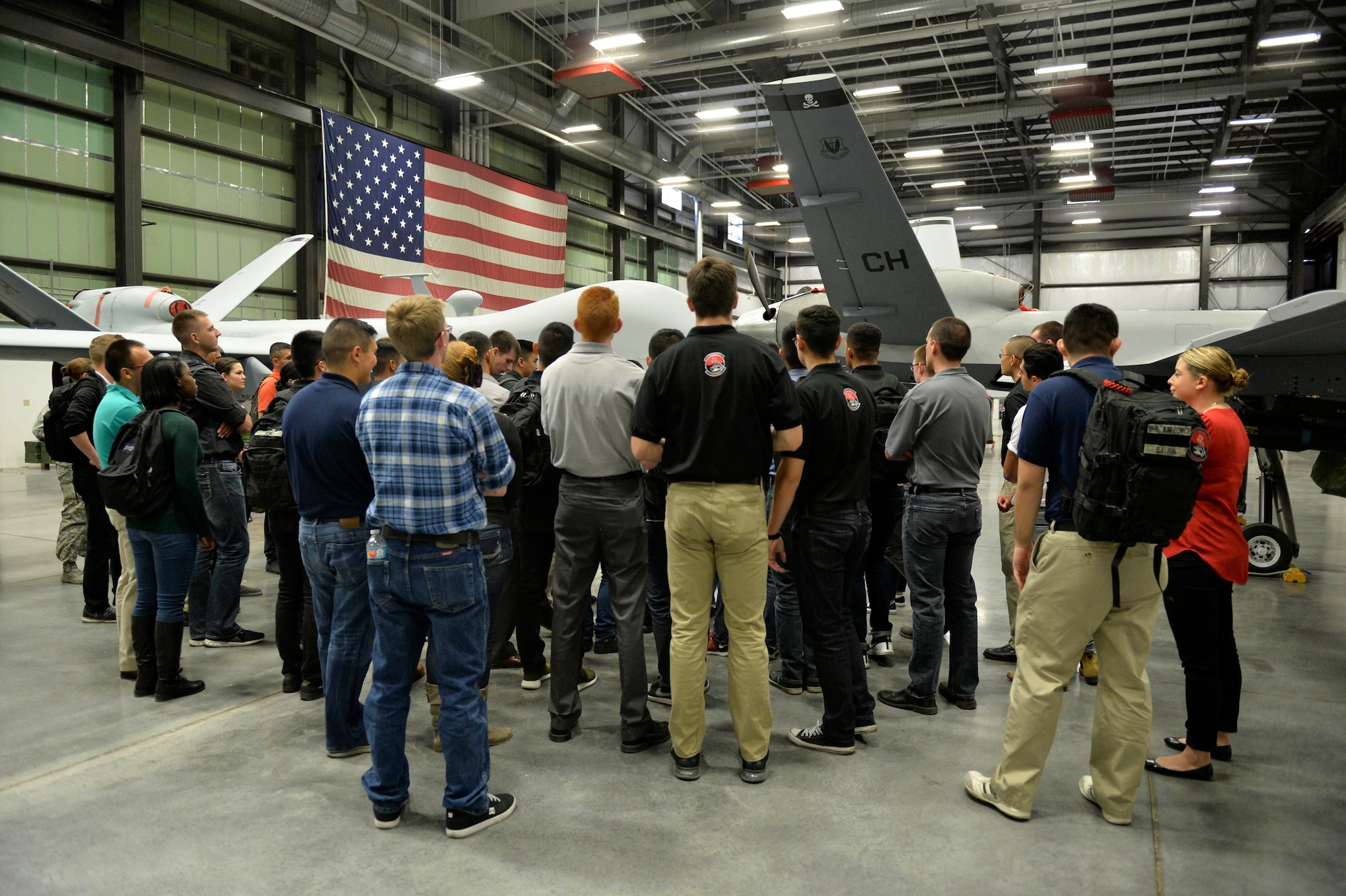 Cadets from the Reserve Officer Training Corps Detachment 004, Las Vegas, take a tour of the 11th Reconnaissance Squadron hangar March 11, 2016, at Creech Air Force, Nevada. The cadets were able to see MQ-1 and MQ-9 remotely piloted aircraft up close, and ask questions about the Aircraft. Questions were answered by Capt. William, 11th RS MQ-1 Predator pilot, who volunteered to assist with the tour. (U.S. Air Force photo by Airman 1st Class Kristan Campbell/Released)