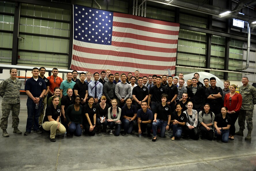 Cadets from the Reserve Officer Training Corps Detachment 004, Las Vegas, pose for a photo in the 11th Reconnaissance Squadron hangar March 11, 2016, at Creech Air Force, Nevada. The cadets were able to see remotely piloted aircraft up close, and ask questions about the aircraft. The briefing included video feed taken of the MQ-1 Predator and MQ-9 Reaper in action, and provided additional information for the soon-to-be officers to consider when choosing a career field. (U.S. Air Force photo by Airman 1st Class Kristan Campbell/Released)