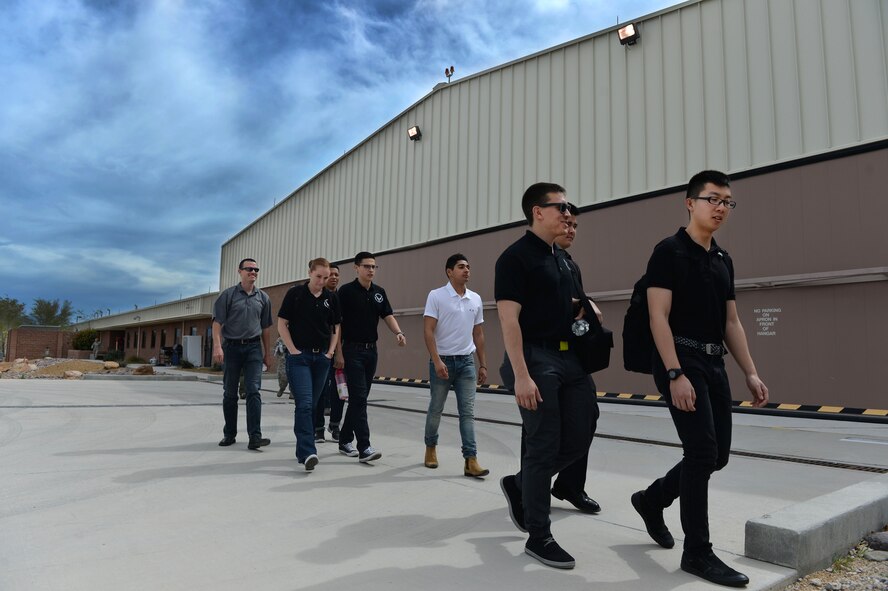 Cadets from the Reserve Officer Training Corps, Detachment 004 in Las Vegas visit the 11th Reconnaissance Squadron March 11, 2016, at Creech Air Force Base, Nevada. During the tour, the students learned MQ-1 and MQ-9 remotely piloted aircraft capabilities to gain a better understanding of the operations at the base. The visit consisted of a mission briefing, lunch and a tour of the 11th RS hangar, where they were provided valuable feedback to questions about the MQ-1s and MQ-9s. (U.S. Air Force photo by Airman 1st Class Kristan Campbell/Released)