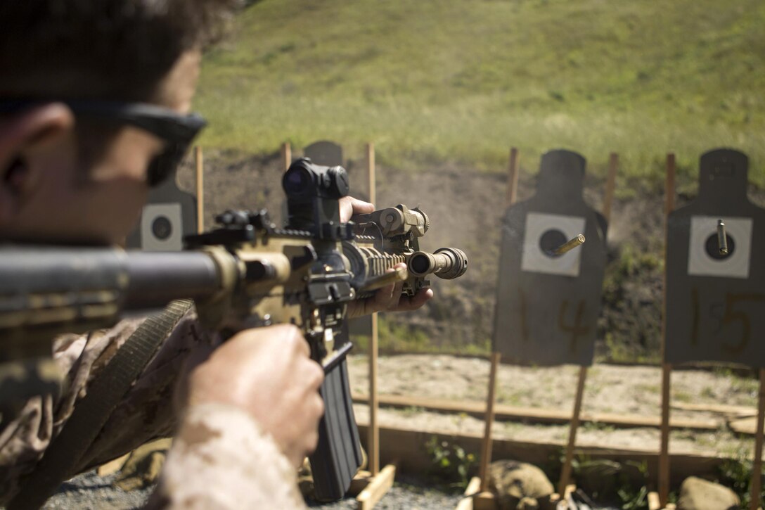 A Marine fires a rifle during a combat marksmanship program at Camp Pendleton, Calif., March 17, 2016. The Marine is assigned to Alpha Company, 1st Reconnaissance Battalion. The program, led by Expeditionary Operations Training Group, sought to prepare participants for an upcoming deployment. Marine Corps photo by Lance Cpl. Justin Bowles



