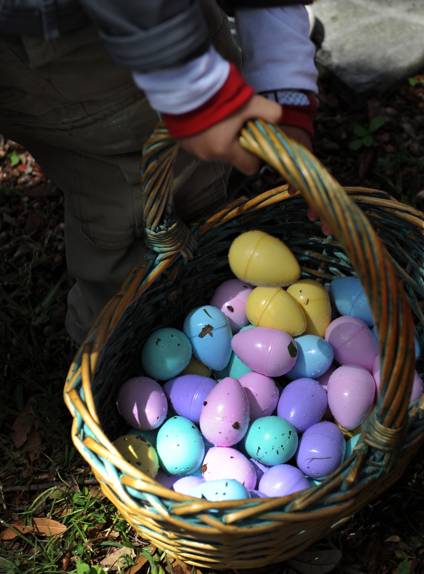 An Easter egg basket is carried during Easter in the Park’s egg hunt at the marina Mar. 26, 2016, Keesler Air Force Base, Miss. The event also included a youth fun run, arts and crafts, games and visits with the Easter Bunny. (U.S. Air Force photo by Kemberly Groue)