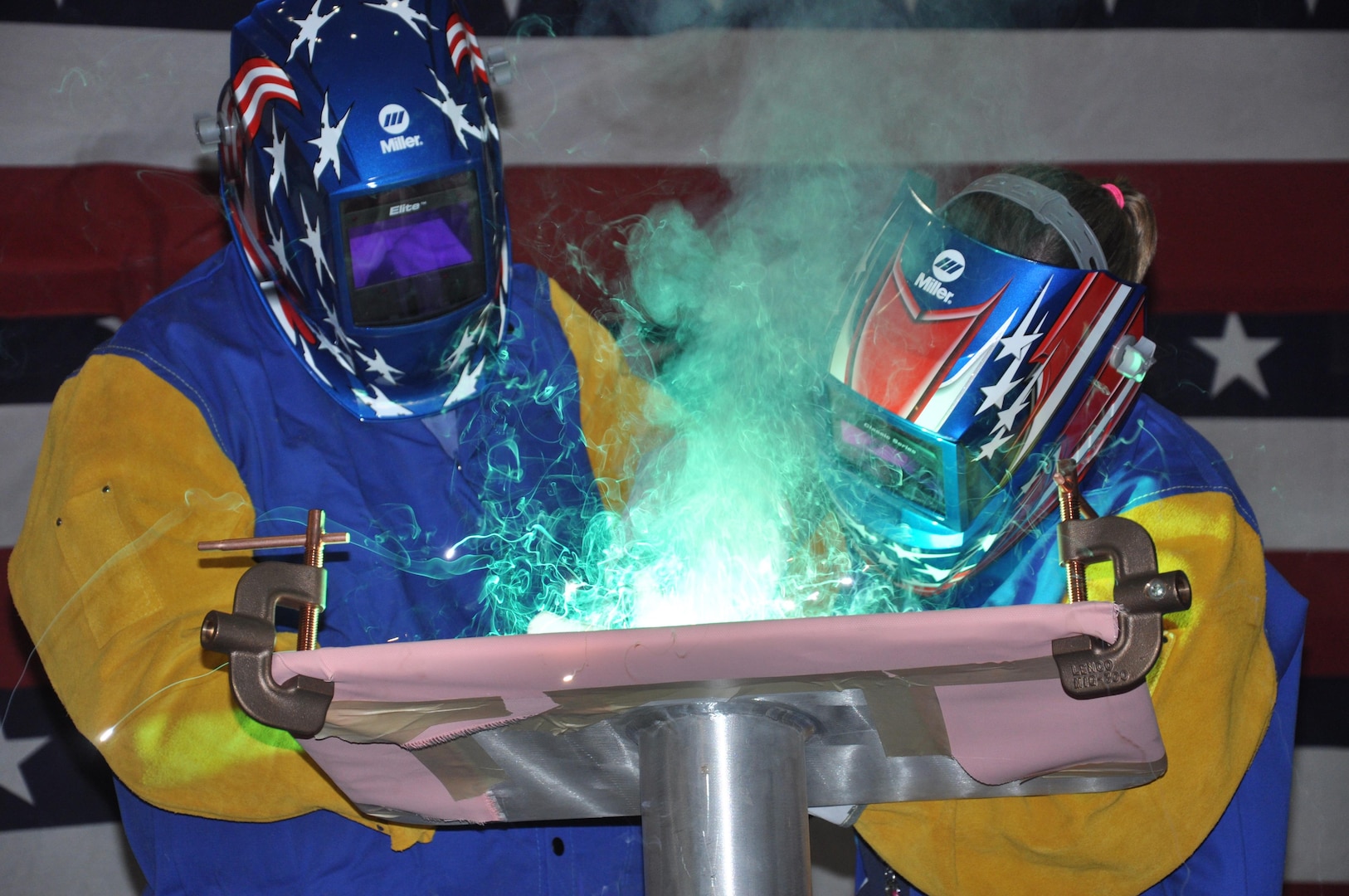 160329-N-YE579-001 (March 29, 2016) MOBILE, Alabama –The Honorable Douglas Nicholls (left), mayor of Yuma, Arizona, etches his initials into the keel plate of the future USNS Yuma (EPF 8) with the help of Austal USA Class A Welder Ms. Courtney Cagle, as part of the Keel Authentication ceremony March 29. Expeditionary Fast Transport Ships, EPFs, are non-combatant vessels designed to operate in shallow-draft ports and waterways, increasing operational flexibility for a wide range of activities.
