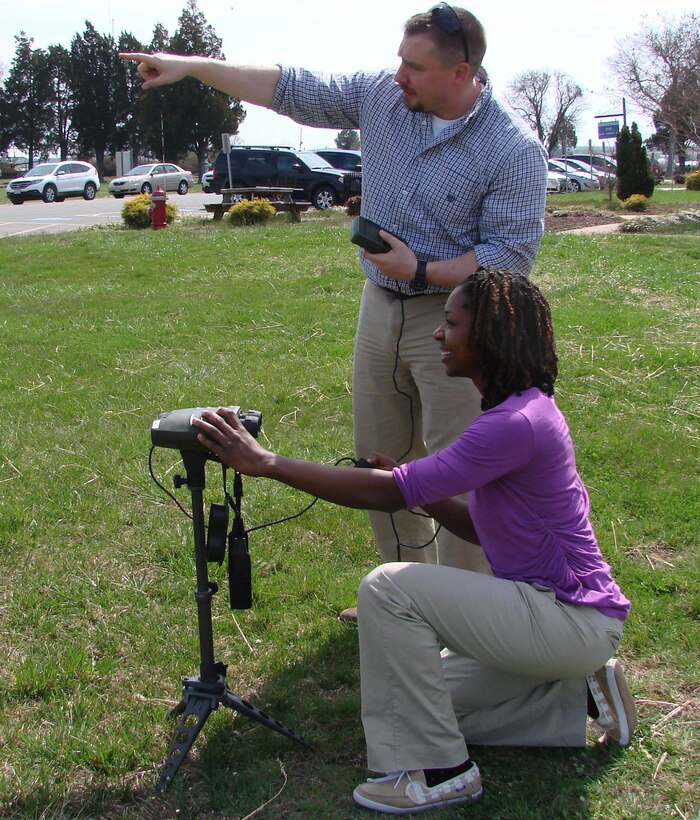DAHLGREN, Va. (March 23, 2016) - Naval Surface Warfare Center Dahlgren Division (NSWCDD) systems engineer Deztany Jackson and NSWCDD scientist Timothy Leancu, a former Marine captain, use the fielded  Common Laser Range Finder (CLRF) and the Defense Advanced GPS Receiver to take targeting measurements. The CLRF is a lightweight, eye-safe laser rangefinder capable of being carried and employed by a single Marine.  It's primary functions are to assist the operator in target acquisition by measuring distance, direction, azimuth and vertical angle from the operator to an object.  The CLRF interfaces with the Defense Advanced GPS Receiver, which is a handheld GPS receiver providing an operator with real-time position measurements. Jackson was honored as a 2016 Black Engineer of the Year (BEYA) Modern-Day Technology Leader during BEYA's 30th annual Science, Technology, Engineering and Mathematics (STEM) Global Competitiveness Conference Awards Gala held in Philadelphia, Feb. 18-20. 