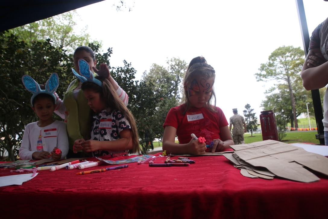 Children participate in arts and crafts at the home of Lt. Gen. Rex C. McMillian, commander of Marine Forces Reserve and Marine Forces North, during the Super-Sized Command Easter Egg Hunt, March 26, 2016. Uniformed service members assigned to MFR and MFN, their families and members of the greater Algiers community were invited to celebrate the holiday together at the historical house.