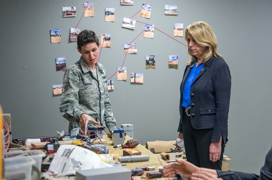 Staff Sgt. Britney Simpson, a 319th Training Squadron military training instructor, briefs Air Force Secretary Deborah Lee James on the anti-terrorism course taught at the Basic Expeditionary Airmen Skills Training (BEAST) Course March 22, 2016, on Joint Base San Antonio-Lackland, Texas. James visited the 37th Training Wing to learn about the Forward Operating Base of the Future project, a joint venture with the Air Force Research Labratory and the University of Dayton Research Institute which converted one zone of the BEAST complex to generate onsite power from renewable energy. (U.S. Air Force photo/Johnny Saldivar)