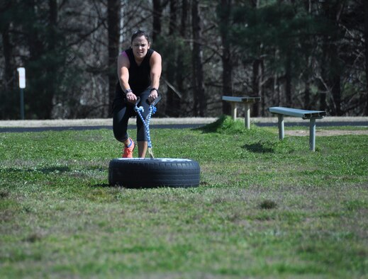 Natalie Campos, 22nd Air Force executive officer, pulls a weighted tire during a mock course session at Dobbins Air Reserve Base, Ga., March 4, 2016 to prepare for the Savage Race obstacle course. Campos lifts weights twice a day, five days a week. (U.S Air Force Photo by Senior Airman Miles Wilson)