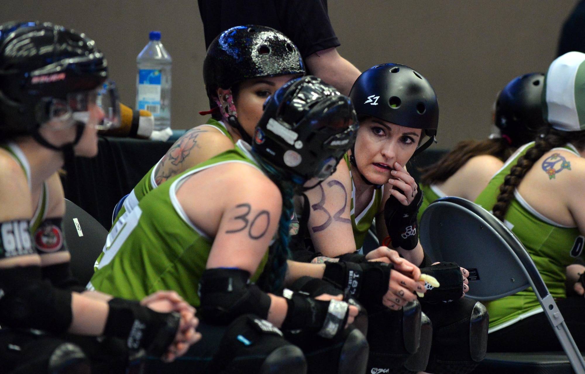 U.S. Air Force Maj. Jocelyn Smith, an executive officer with the 55th Wing Headquarters, takes a quick break from the roller derby game held at the Ralston Arena, Neb., March 26, 2016. Once she dons her skates, Smith becomes Amelia Airhurt of the Omaha Rollergirls derby team.  (U.S. Air Force photo by Josh Plueger/Released)