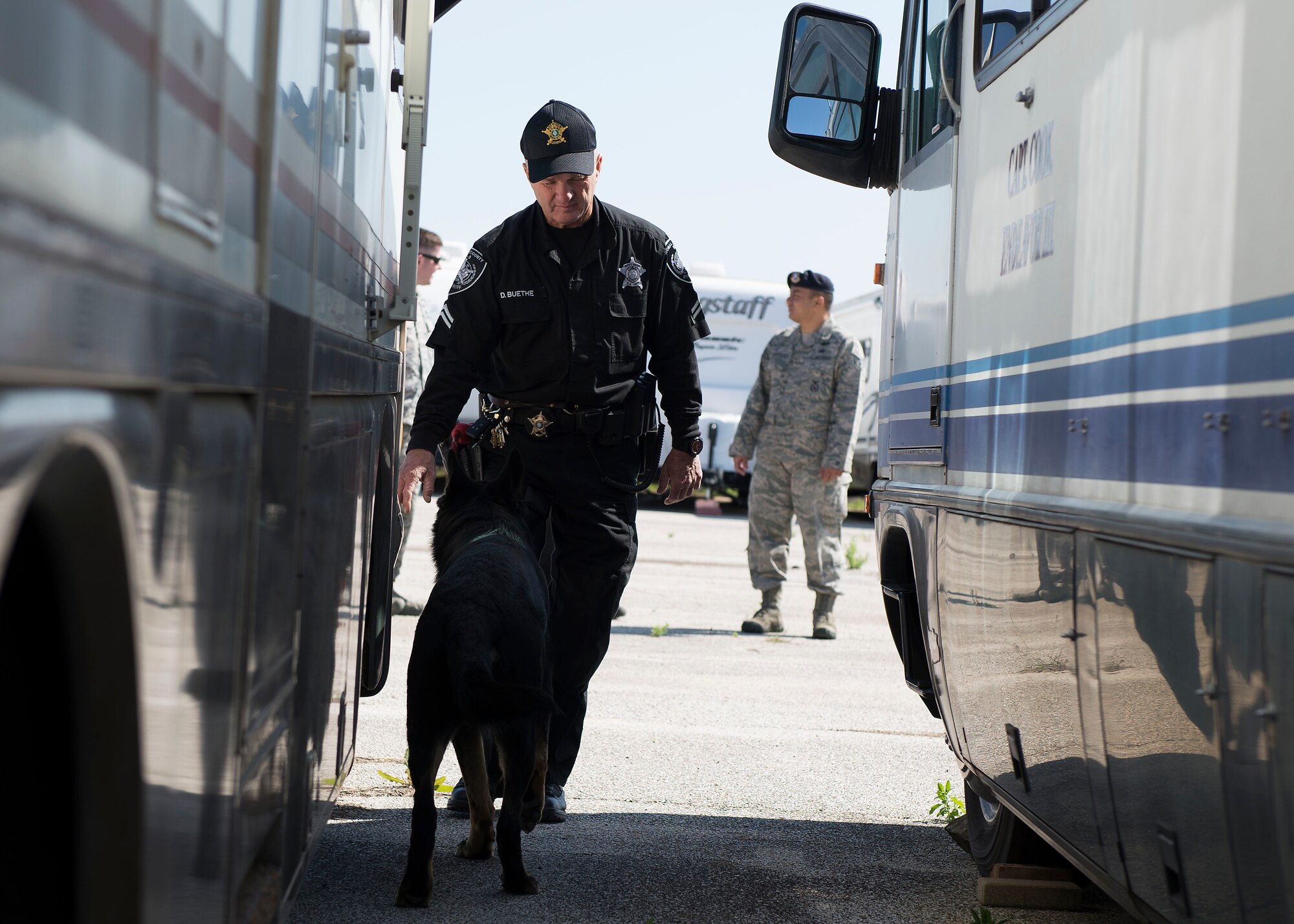 Deputy Duane Buethe, Comal County Sheriff’s Department K-9 unit corporal in charge, runs through an explosives exercise with his dog R.J. at Joint Base San Antonio-Randolph March 28, 2016. Buethe helps train the K-9 unit’s dogs for patrolling and detecting narcotics, explosives and guns and ammunition. 