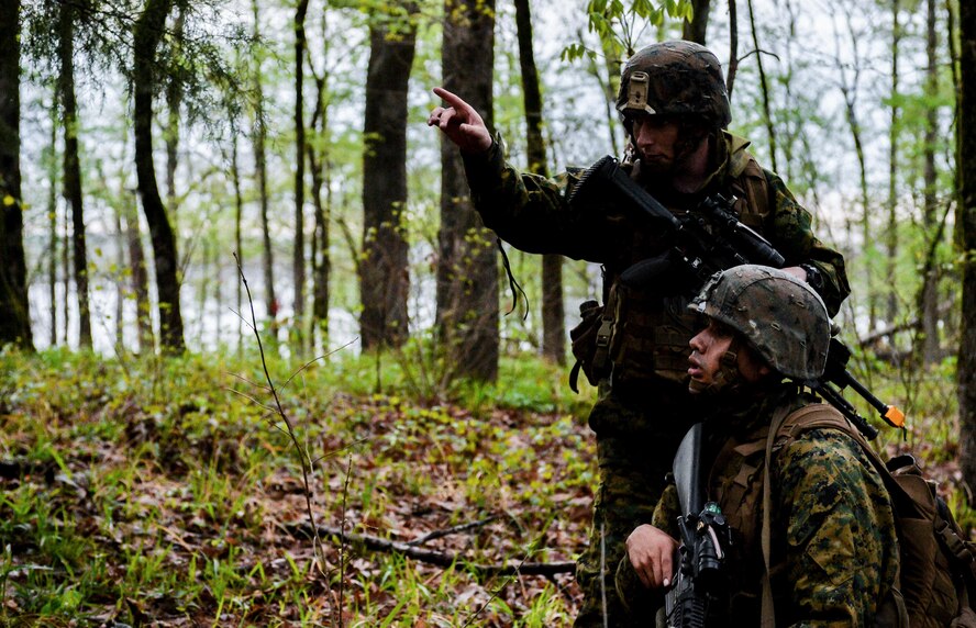 U.S. Marines with Bravo Company, 1st Battalion, 23rd Marine Regiment, 4th Marine Division, sets up a security perimeter during a patrol exercise at Barksdale Air Force Base, La., March 18, 2016. The fire team leader directed riflemen to designated sectors and created a secured perimeter during an operational pause. (U.S. Air Force photo/Senior Airman Mozer O. Da Cunha)