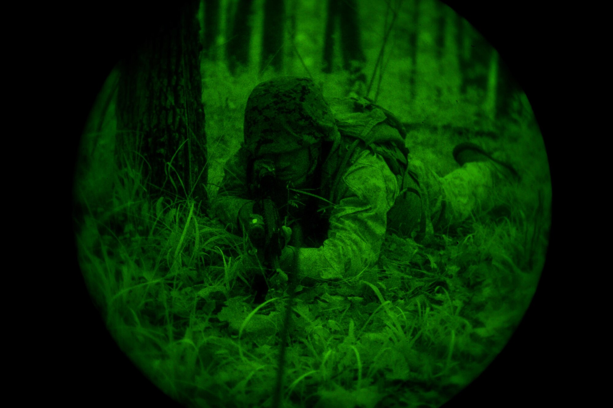 A U.S. Marine with Bravo Company, 1st Battalion, 23rd Marine Regiment, 4th Marine Division, provides security during a patrol exercise at Barksdale Air Force Base, La., March 18, 2016. The simulated security perimeter provided platoon leadership with a secure location to review maps, rehydrate and coordinate upcoming movements. (U.S. Air Force photo/Senior Airman Mozer O. Da Cunha)