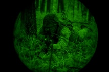 A U.S. Marine with Bravo Company, 1st Battalion, 23rd Marine Regiment, 4th Marine Division, provides security during a patrol exercise at Barksdale Air Force Base, La., March 18, 2016. The simulated security perimeter provided platoon leadership with a secure location to review maps, rehydrate and coordinate upcoming movements. (U.S. Air Force photo/Senior Airman Mozer O. Da Cunha)