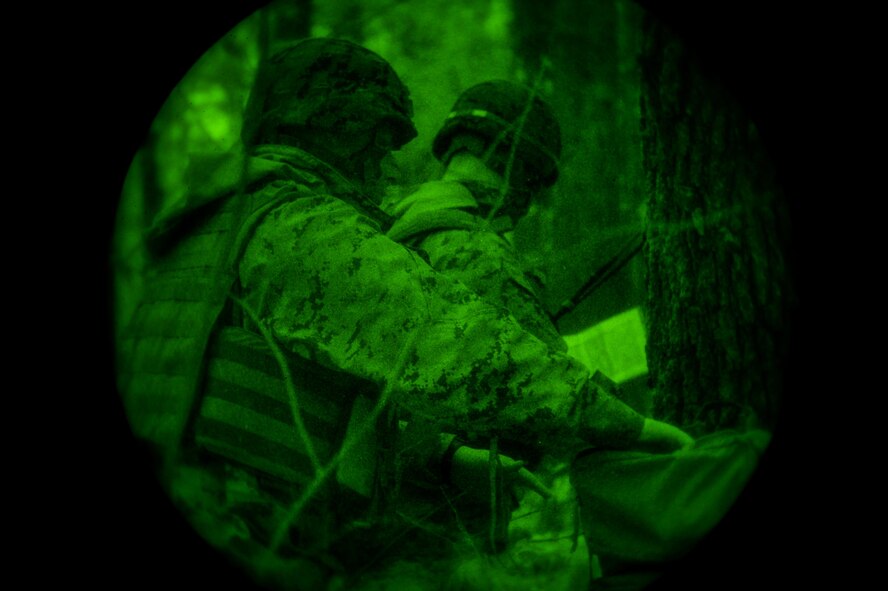 U.S. Marines with Bravo Company, 1st Battalion, 23rd Marine Regiment, 4th Marine Division, consult a map during a patrol exercise exercise at Barksdale Air Force Base, La., March 18, 2016. As part of the exercise, each platoon was instructed to locate and navigate to a position marked on a map and set up a base of operations. (U.S. Air Force photo/Senior Airman Mozer O. Da Cunha)
