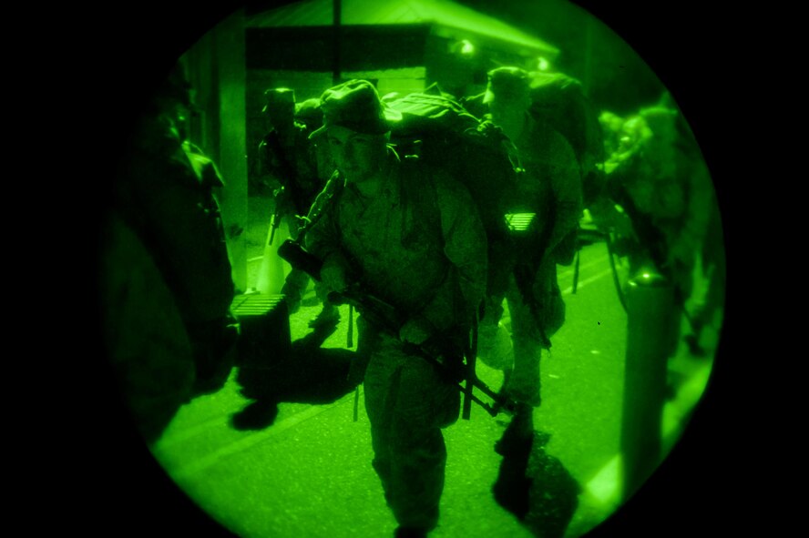 U.S. Marine Lance Cpl. Shane Guillot, a rifleman with Bravo Company, 1st Battalion, 23rd Marine Regiment, 4th Marine Division, marches in a conditioning march during a training exercise at Barksdale Air Force Base, La., March 18, 2016. Over 100 reserve Marines marched approximately 9-miles carrying more than 70 pounds of equipment into the exercise area. (U.S. Air Force photo/Senior Airman Mozer O. Da Cunha)