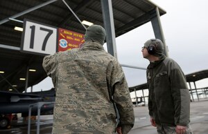 Senior Airman Stephan Giorgio (right), 366th Contracting Squadron contract specialist, conducts a site survey of a flight line sign and sun-shade lights with a customer, Technical Sgt. Theodore Marx, at Mountain Home AFB, Idaho, March 29, 2016. Research and site surveys are a critical part of Giorgio’s job of ensuring contractors and customers get the product best suited to their needs. 