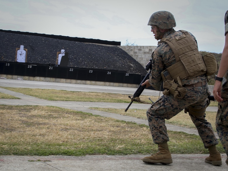 MARINE CORPS BASE HAWAII — Cpl. Zachary Summers, a radio operator with 3rd Radio Battalion runs from one side of the range to the other as part of a course of fire during the Pacific Combat Shooting Match at the Kaneohe Bay Range Training Facility aboard Marine Corps Base Hawaii, March 16, 2016. Teams from different units used various weapons and tactics to achieve the fastest time possible on different courses of fire, while earning points for awards during the competition. Marines from the Marine Corps Combat Shooting Team instructed and gave advice to the Marines participating in the event. (U.S. Marine Corps Photo by Lance Cpl. Jesus Sepulveda Torres)