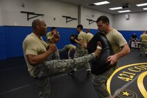 Airmen practice combatives during the Air Force Phoenix Raven Training course at the U.S. Air Force Expeditionary Center on Fort Dix, N.J. March 10, 2016. The raven course, taught by the 421st Combat Training Squadron, teaches security forces Airmen specialized training in aircraft security, combatives and verbal judo. (U.S. Air Force Photo/Tech. Sgt. Jaimie Powell)
