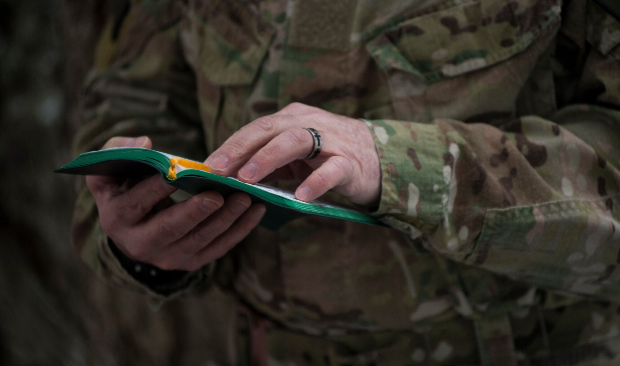 Major Jonathan Harmon, 336th Training Support Squadron combat rescue officer , provides a Catholic service to Airmen in the field March 27, 2016, at Fairchild Air Force Base, Wash. The Easter services in the field started last year, to give students and instructors the opportunities to worship even when training. (U.S. Air Force photo/Airman 1st Class Sean Campbell)

