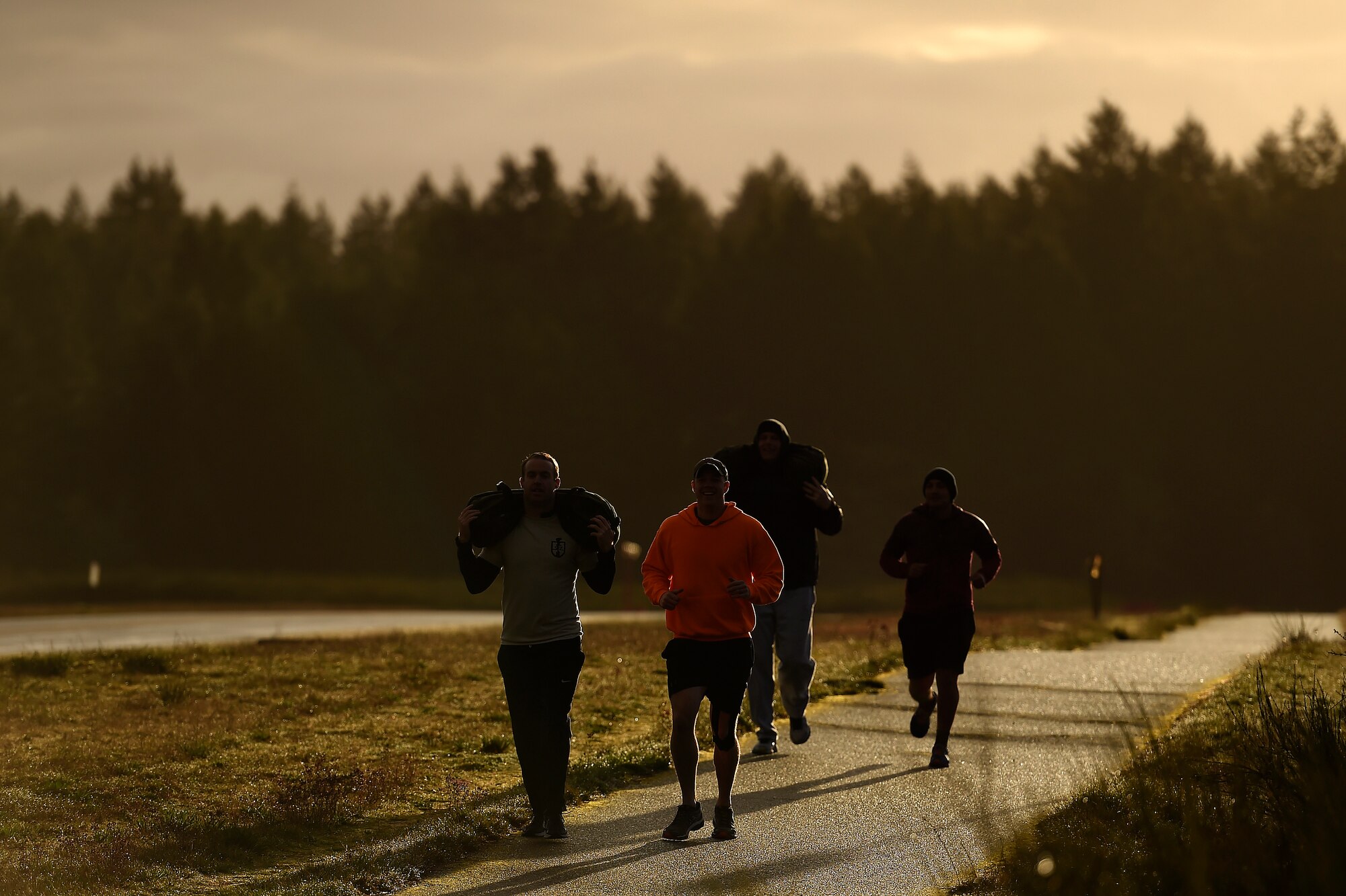 Participants in the Tactical Air Control Party 24-hour-run, log some early morning miles at Joint Base Lewis-McChord, Wash., March, 24, 2016. The run raised funds for the TACP Association to support families of TACP members who have died in combat or training. (U.S. Air Force photo/Tech. Sgt. Tim Chacon)