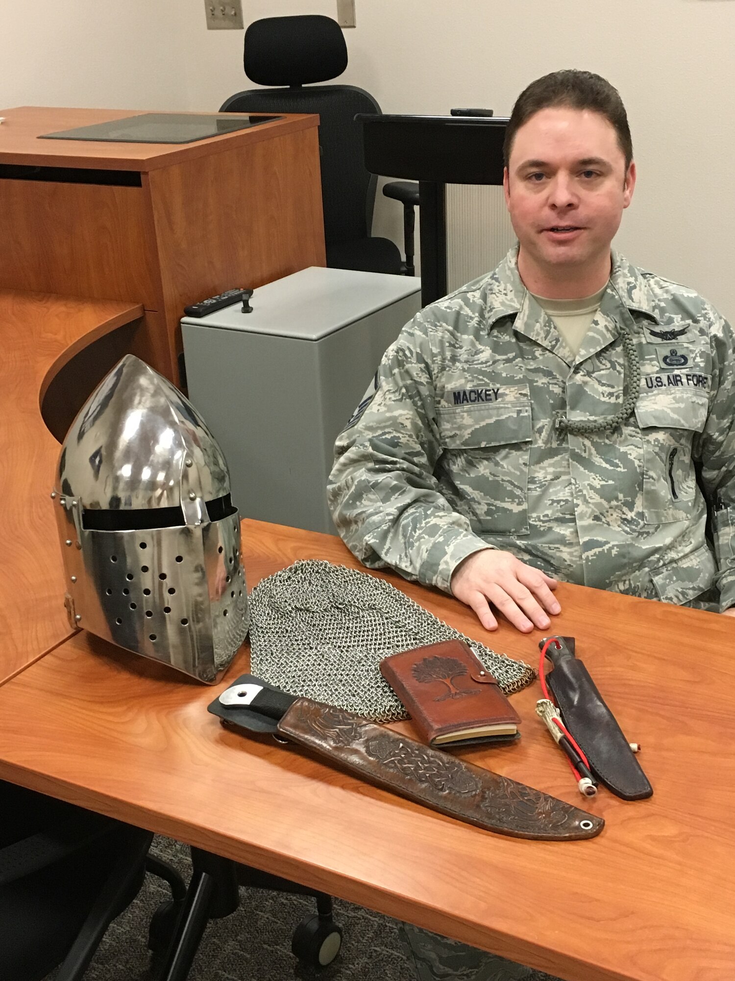 PETERSON AIR FORCE BASE, Colo. – Master Sgt. Paul Mackey, 21st Force Support Squadron career assistance advisor, displays items he designed and created in his spare time. He has primarily focused on leatherwork and knife making. (U.S. Air Force photo by Dave Smith)
