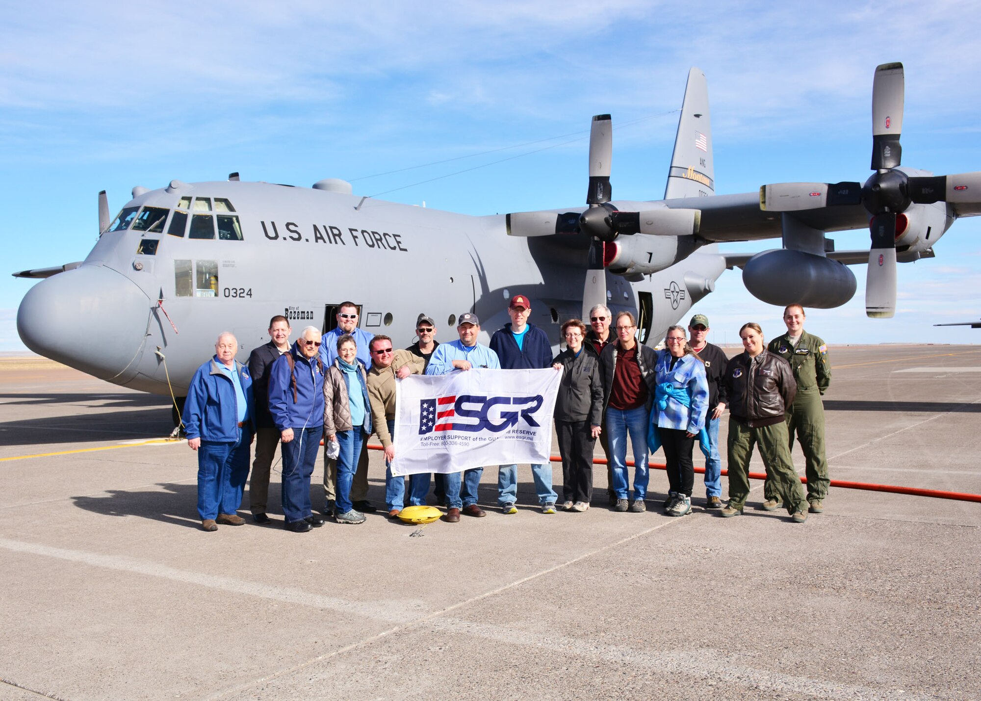 Employers and community leaders pose in front of a 120th Airlift Wing C-130 Hercules transport aircraft during the Employer Support of the Guard and Reserve (ESGR) “Breakfast with the Boss” event held on base in Great Falls, Mont. March 5, 2016.   (U.S. Air National Guard photo by Senior Master Sgt. Eric Peterson)