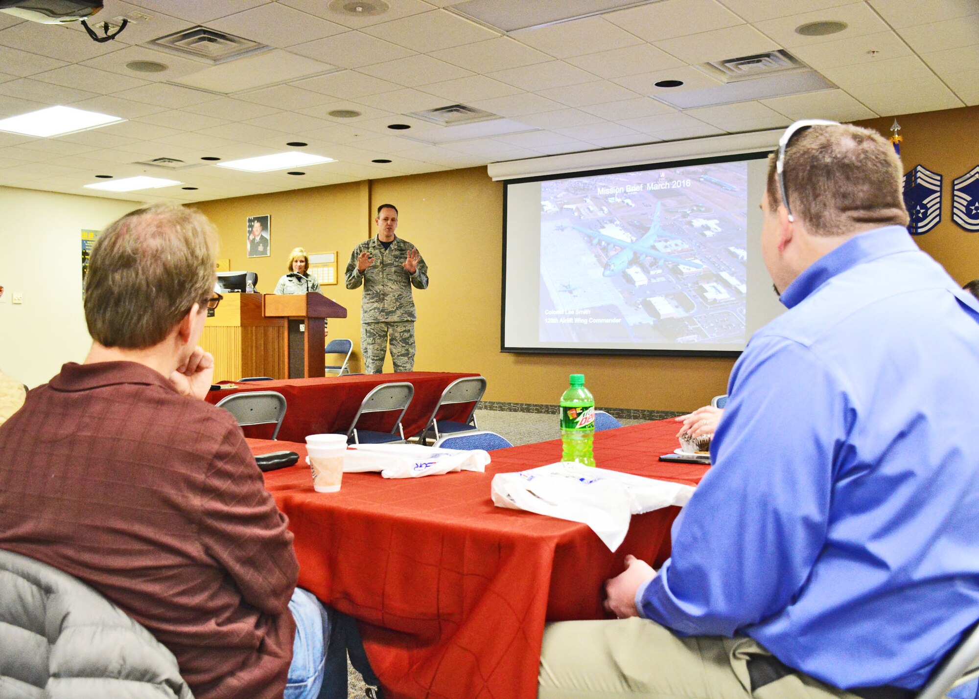 120th Airlift Wing Commander Col. Lee Smith briefs employers and community leaders during the Employer Support of the Guard and Reserve (ESGR) “Breakfast with the Boss” event held on base in Great Falls, Mont. March 5, 2016.   (U.S. Air National Guard photo by Senior Master Sgt. Eric Peterson)