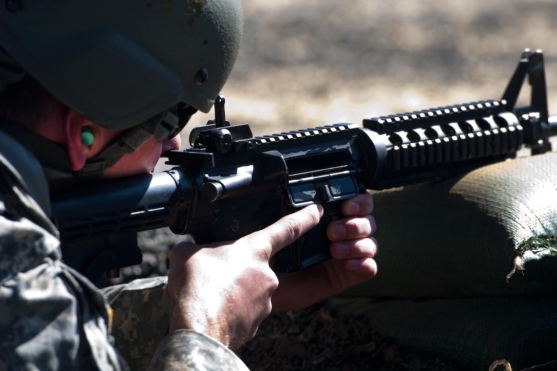 A soldier prepares to fire his weapon at a target on a firing range during the 2016 Best Warrior and Drill Sergeant of the Year competition at Fort Jackson, S.C., March 22, 2016. Army photo by Maj. Michelle Lunato 
