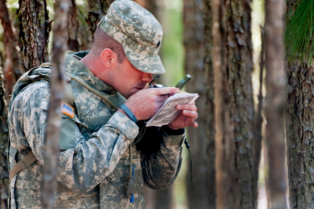 Army Sgt. David Brown checks his compass reading during the land navigation part of the 2016 Best Warrior and Drill Sergeant of the Year competition at Fort Jackson, S.C., March 22, 2016. Brown is assigned to the 98th Training Division. Army photo by Maj. Michelle Lunato