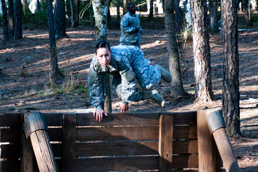 Army Spc. Kayla Bundy hurdles a wall obstacle during the 2016 Best Warrior and Drill Sergeant of the Year competition at Fort Jackson, S.C., March 23, 2016. Bundy is assigned to the 95th Training Division. Army photo by Maj. Michelle Lunato