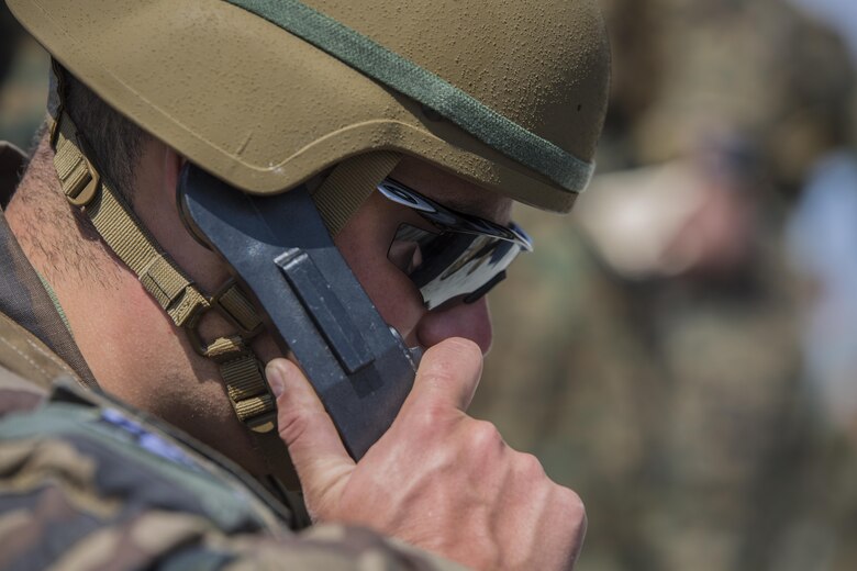 A Dutch Marine with 25 Reconnaissance Surveillance calls in targets and directs fires during a joint tactical air operation at Camp Lejeune, N.C., March 25, 2016. The training enhanced interoperability between the U.S., French, British, and Dutch forces, while the U.S. Marines provided fire and aviation support.  (U.S. Marine Corps photo by Lance Cpl. Erick Galera/Released)