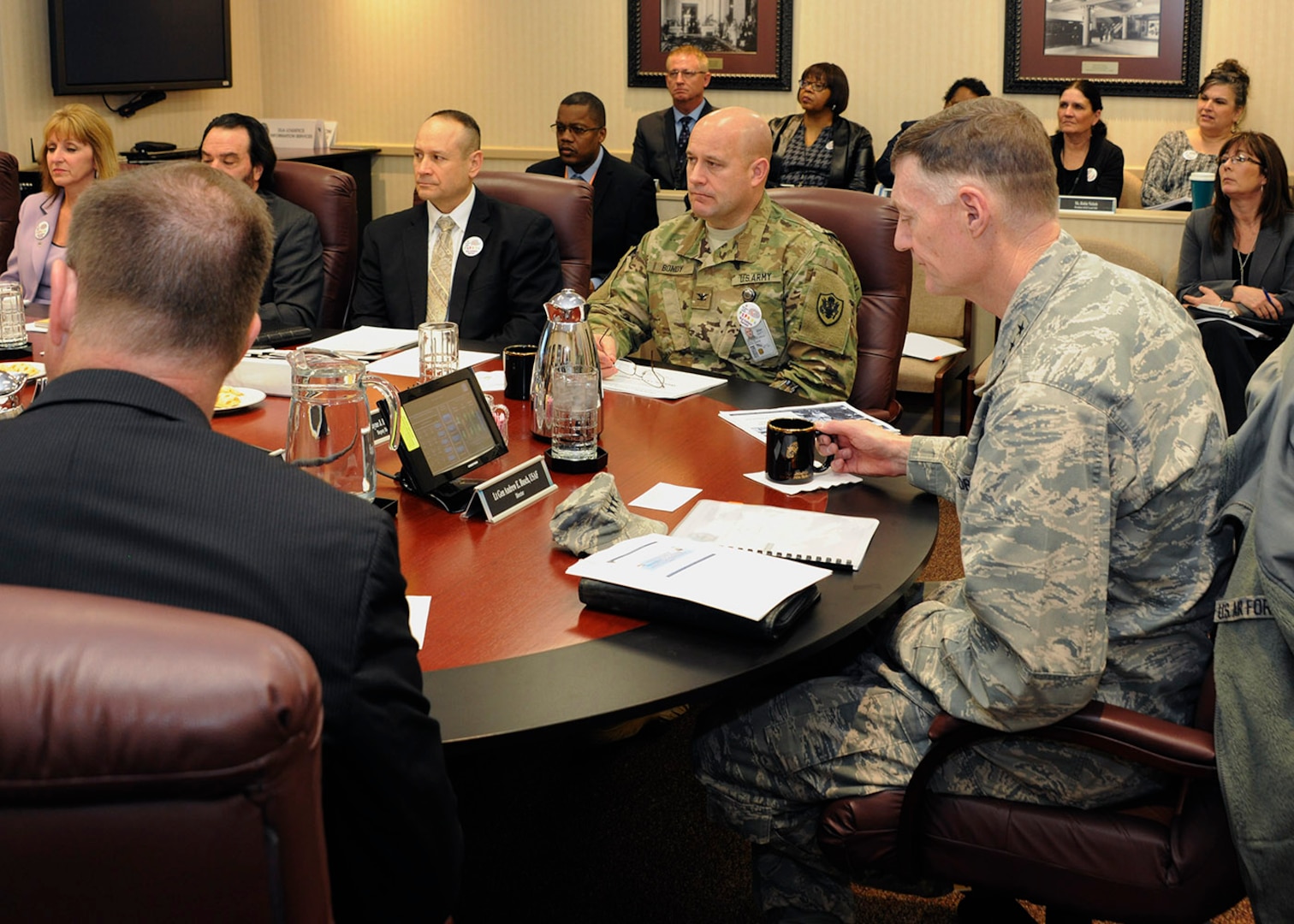 DLA Director Air Force Lt. Gen. Andy Busch (right) listens as staff members brief him on DLA Disposition Services’ Annual Operation Plan.