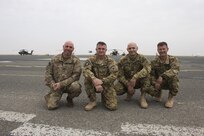 California Army National Guard Capt. Eric Lancaster, Chief Warrant Officer 3 Michael DeCosta, Lt. Col. Nader Araj and Lt. Col. Brian Goldsmith meet up on the airfield at Camp Buehring, Kuwait, Feb. 28. They all live and work in the Folsom community back home in California, and deployed together with the 40th Combat Aviation Brigade. 