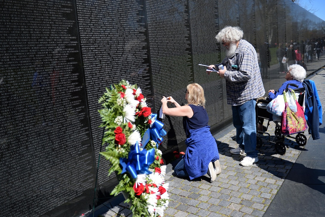 Family members and tourists pay respects to the fallen heroes of the Vietnam War at the Vietnam Veterans Memorial in Washington, D.C., March 29, 2016. DoD photo by Marvin Lynchard