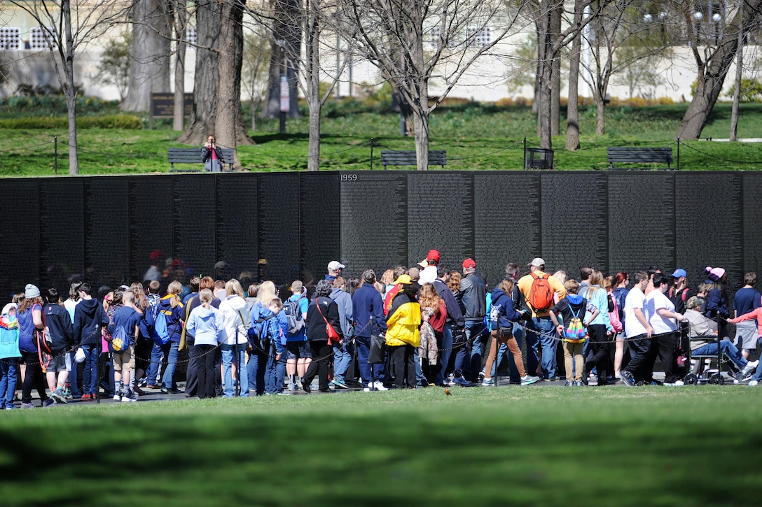 Crowds of people pay respects to fallen and missing service members from the Vietnam War at the Vietnam Veterans Memorial in Washington, D.C., March 29, 2016. DoD photo by Marvin Lynchard