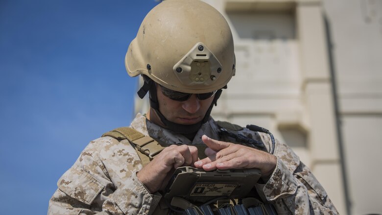 Capt. Richard Bussmann, a joint tactical air controller with 4th Air Naval Gunfire Liaison Company, takes notes as he directs fires during a joint tactical air operation at Marine Corps Base Camp Lejeune, North Carolina, March 25, 2016. 4th ANGLICO, a reserve unit, participated in the exercise to enhance interoperability between the U.S., French, British, and Dutch forces, while the U.S. Marines provided fire and aviation support.