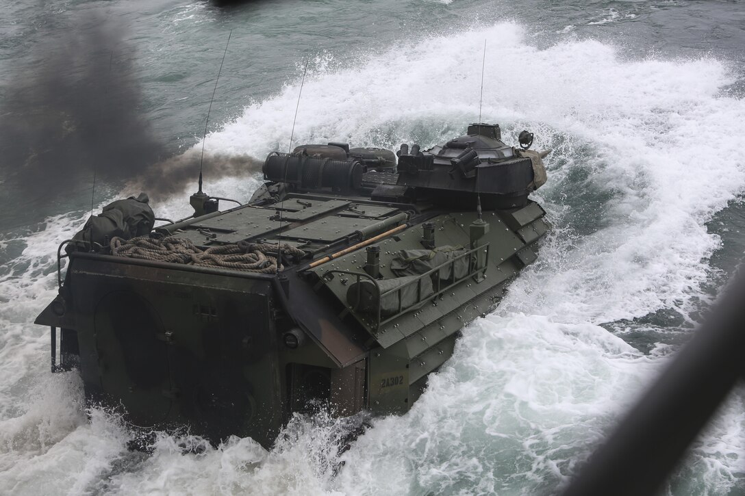 U.S. Marines with Battalion Landing Team 1/6, 22nd Marine Expeditionary Unit depart the USS Whidbey Island in assault amphibious vehicles during PHIBRON/MEU Integration Training, March 20, 2016. PMINT was conducted as part of training required of Marines and Sailors preparing for an upcoming deployment. 