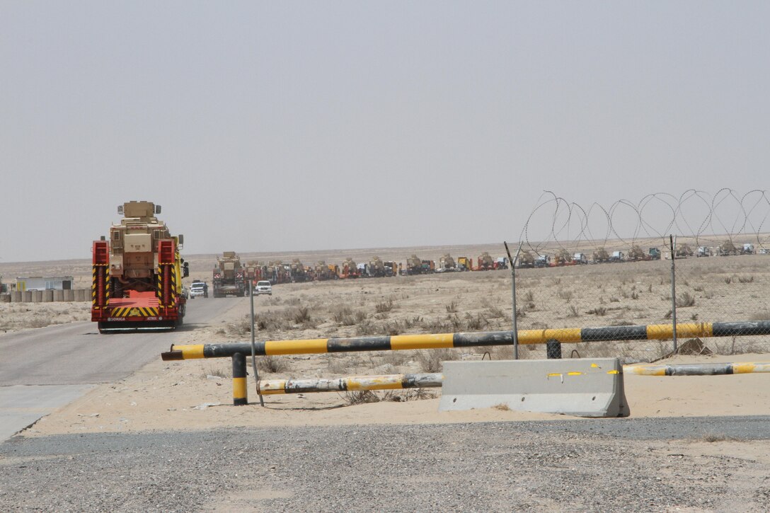 K-Crossing, Kuwait –An Iraqi tractor-trailer convoy head back to Baghdad after receiving their cargo of Caiman MRAPs. The delivery of the 28 MRAPs to the Iraqi government is part of the US-led Iraqi Security Forces Development and Equipping Program. (US Army photo by Master Sgt. Dave Thompson, 1TSC Public Affairs)