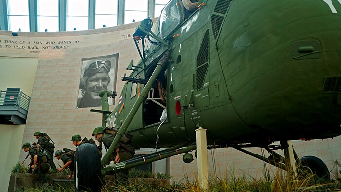 This new tableau depicts Marines heading for cover as they exit a Vietnam-era  Sikorsky UH-34D helicopter during Operation Starlite in 1965.  Active duty Marines and a Corpsman were used as models to create the cast  figures for the new tableau. 
